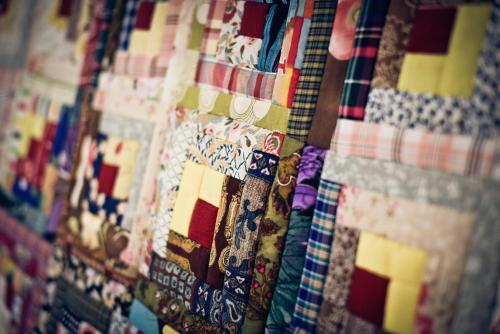 a close up of a quilt hanging on a wall at Quinta Verde Sintra - Casa de Campo in Sintra