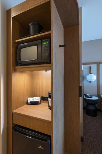 a microwave sitting on a shelf in a room at Fairfield Inn & Suites by Marriott Colorado Springs East in Colorado Springs