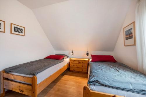 Una cama o camas en una habitación de Inselpanorama Pellworm