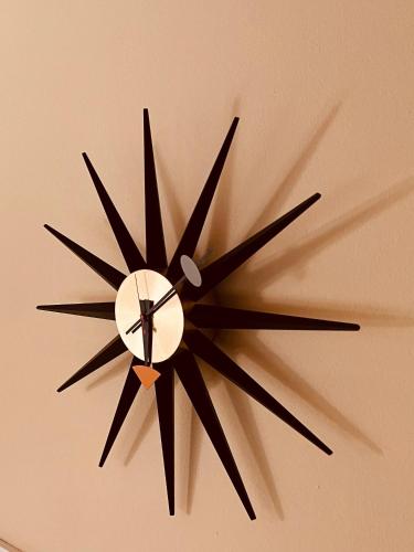 a clock is hanging on a wall at ARTvacanza Atelierhaus Edenkoben in Edenkoben