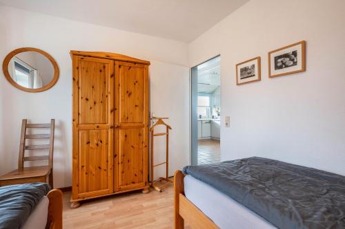 Una cama o camas en una habitación de Inselpanorama Pellworm
