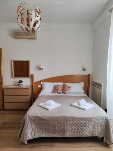 Postel nebo postele na pokoji v ubytování Guest House Rome Termini Station