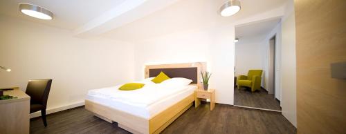 Postel nebo postele na pokoji v ubytování Boardinghouse Rülzheim