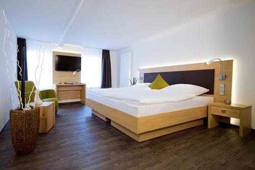 Postel nebo postele na pokoji v ubytování Boardinghouse Rülzheim