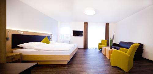 Postel nebo postele na pokoji v ubytování Boardinghouse Rülzheim