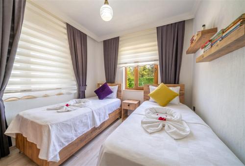 Postel nebo postele na pokoji v ubytování Villa Güneş