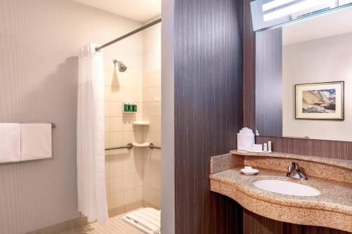 a bathroom with a sink and a shower at Courtyard Boston Copley Square in Boston