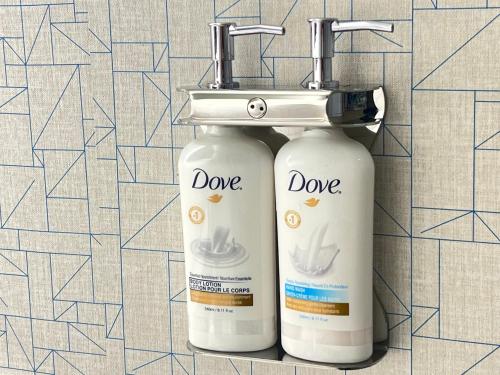 two bottles ofodorizers are sitting next to each other at Holiday Inn Express Toronto Downtown by IHG in Toronto