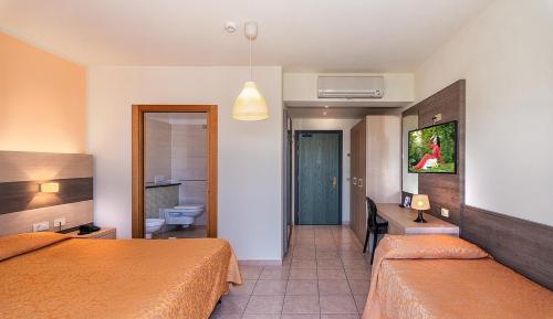 Letto o letti in una camera di Hotel Dei Tigli