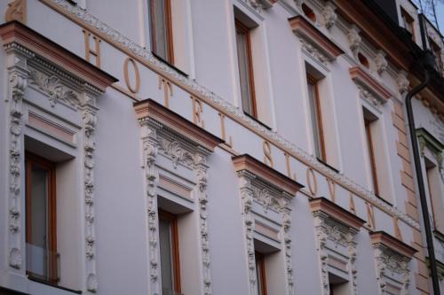 a facade of a building with the words hotel at Hotel Slovan in Jeseník