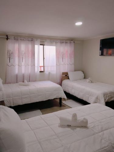 Ένα ή περισσότερα κρεβάτια σε δωμάτιο στο Hotel Victoria