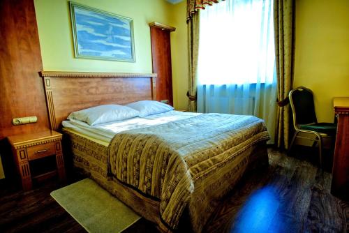 Una cama o camas en una habitación de Hotel Pietrak