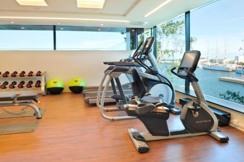 a gym with a view of the water at Courtyard by Marriott Gdynia Waterfront in Gdynia
