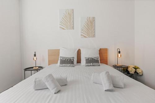 Ένα ή περισσότερα κρεβάτια σε δωμάτιο στο Appartement neuf entre plaine et montagnes