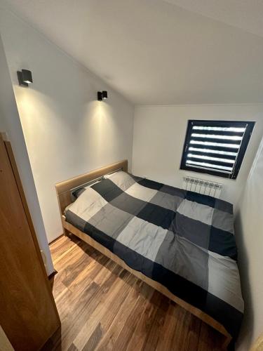 a bedroom with a bed and a window at Micic Apartment 2 Divcibare in Divčibare