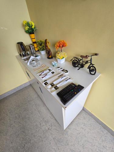 a white counter with a bunch of objects on it at Kodai Hillscape in Kodaikānāl