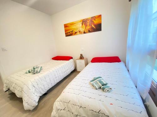 Ένα ή περισσότερα κρεβάτια σε δωμάτιο στο Itos Flats Infiesto