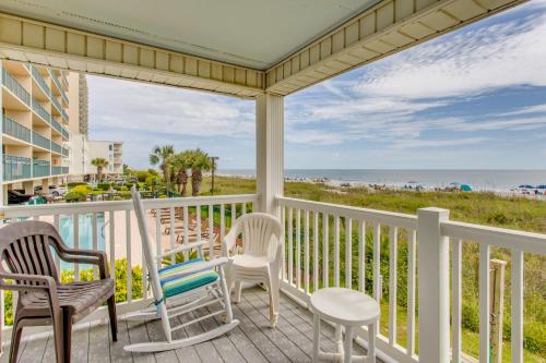 a balcony with chairs and a view of the beach at Oceanfront North Myrtle Beach Condo with Patio! in Myrtle Beach