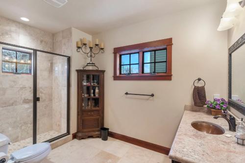 a bathroom with a shower and a sink and a toilet at Majestic Getaway in Steubenville