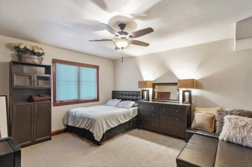 a bedroom with a bed and a ceiling fan at Majestic Getaway in Steubenville