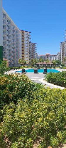 a view of a resort with a pool and buildings at Filed Residences Hotel Apartment in Manila