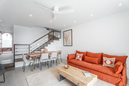 a living room with a couch and a table at Villa in Parque Santiago III in Playa de las Americas