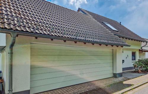a garage door in front of a house at Nice Home In Bad Ems With Kitchen in Bad Ems