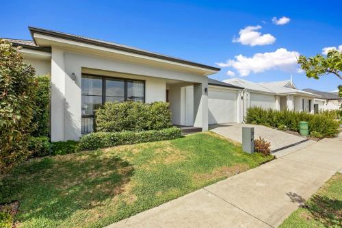 a row of houses in a residential neighborhood at A wonderful life in the heart of Treeby in Perth