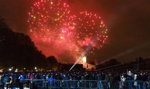 a crowd of people watching a fireworks show at night at PENTHOUSE SERVICED APARTMENT IN CAMBERLEY TOWN CENTRE, WITH FREE PARKING, FREE WiFi, LIFT AND BALCONY ACCESS, PERFECT FOR BUSINESS STAYS, FAMILIES, RELOCATIONS, EXTENDED STAYS, AND EMERGENCY ACCOMMODATION by REDWOOD STAYS in Camberley