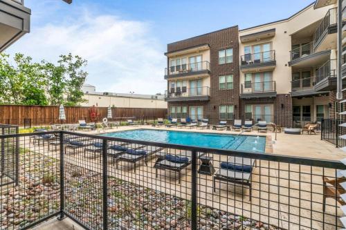 an image of a swimming pool at a apartment complex at Serene Escape 1BD Pool 2 min to TCU in Fort Worth