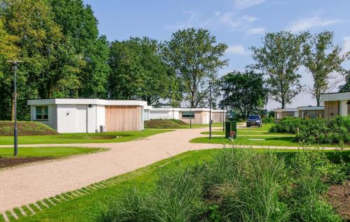 a walkway in front of a row of buildings at 2 Bedroom Stunning Home In Afferden in Afferden