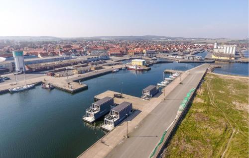 an aerial view of a marina with boats in the water at 3 Bedroom Amazing Ship In Nexø in Neksø