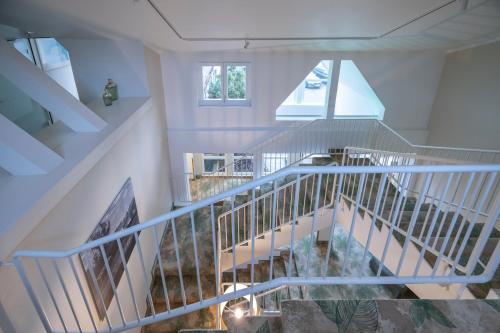 an overhead view of a staircase in a house at Fletcher Waldhotel Nordrhein-Westfalen in Heiligenhaus