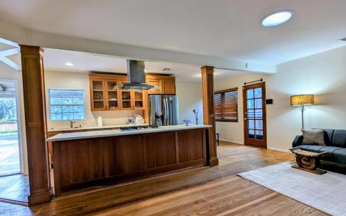 a kitchen with a large island in a living room at Entire House,Convinient location in Los Angeles , near Universal, Hollywood, Pets Friendly, Free WIFI in Sherman Oaks Community Hospital Heliport