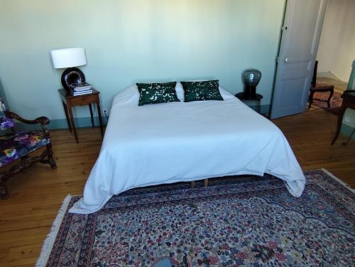 Una cama o camas en una habitación de CLOCHI-CLOCHA