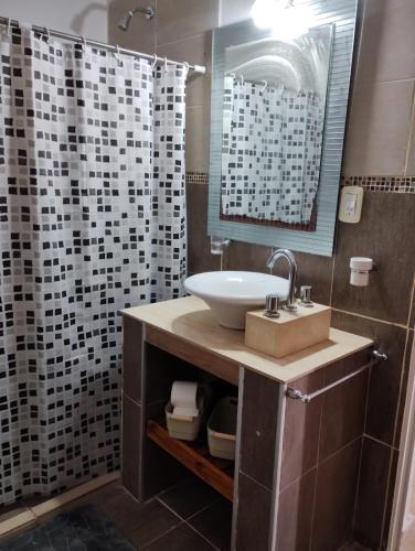 a bathroom with a sink and a shower at Casa Poetas in Villa Nueva