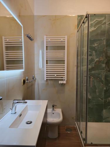 a bathroom with a sink and a shower and a toilet at Casa Belvedere - Centro Storico in Barletta