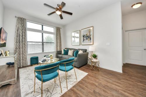 a living room with a couch and a table at The Alexan* Walk to NRG* TX Med Center* Downtown in Houston