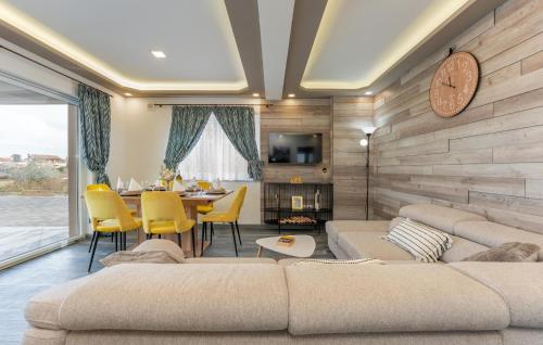 a living room with a couch and a table at Stunning Home In Banj in Banj