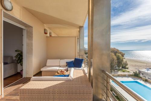 a balcony with a view of the ocean at Casa Futuro - Beautiful sea view with pool in Torre Grande