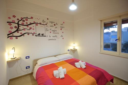 Katil atau katil-katil dalam bilik di Casa del Maestrale seaside apartment 35 min from Rome