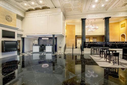 a lobby with a table and chairs in a building at Courtyard by Marriott Boston Downtown in Boston