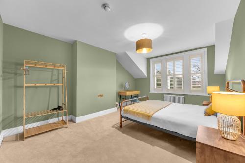 a bedroom with a bed and a window at Harrogate Heights - Luxury 6 Bed Central Harrogate Home in Harrogate