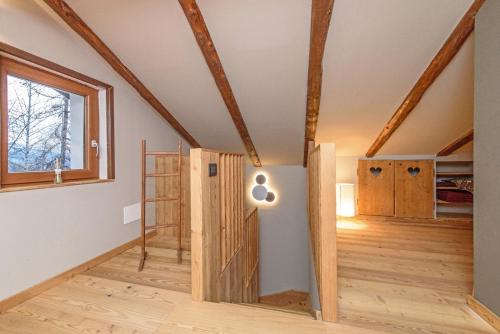 a room with a wooden door in a house at La casa dello scoiattolo CIR COMUNALE N 20 in Gressan