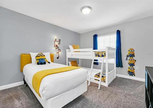 a bedroom with a white bed and a bunk bed at 1569 SD - Spacious Champions Gate Retreat with Modern Amenities in Davenport