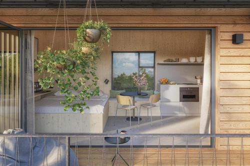 a kitchen and dining area of a house at Ostsee Baumhaushotel in der Natur mit Sauna und Whirlpool in Wangels