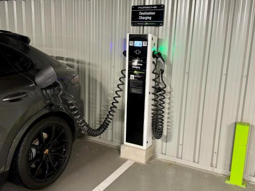 a car is parked next to a pay phone at Urban A+++ Hotel in Tres Cantos