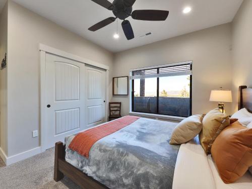a bedroom with a bed and a ceiling fan at Elk Haven in Alton