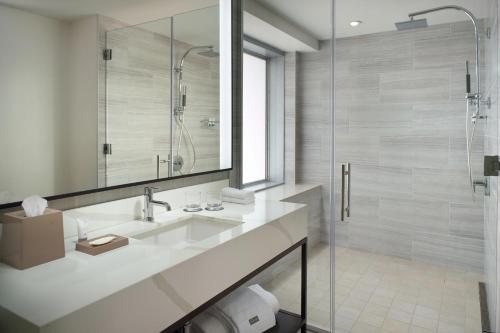 a bathroom with a sink and a shower at The Westin Charlotte in Charlotte