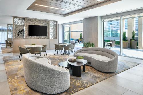 a living room with two couches and a tv at The Westin Charlotte in Charlotte
